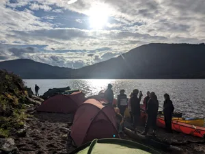 Group at camp in silhouette